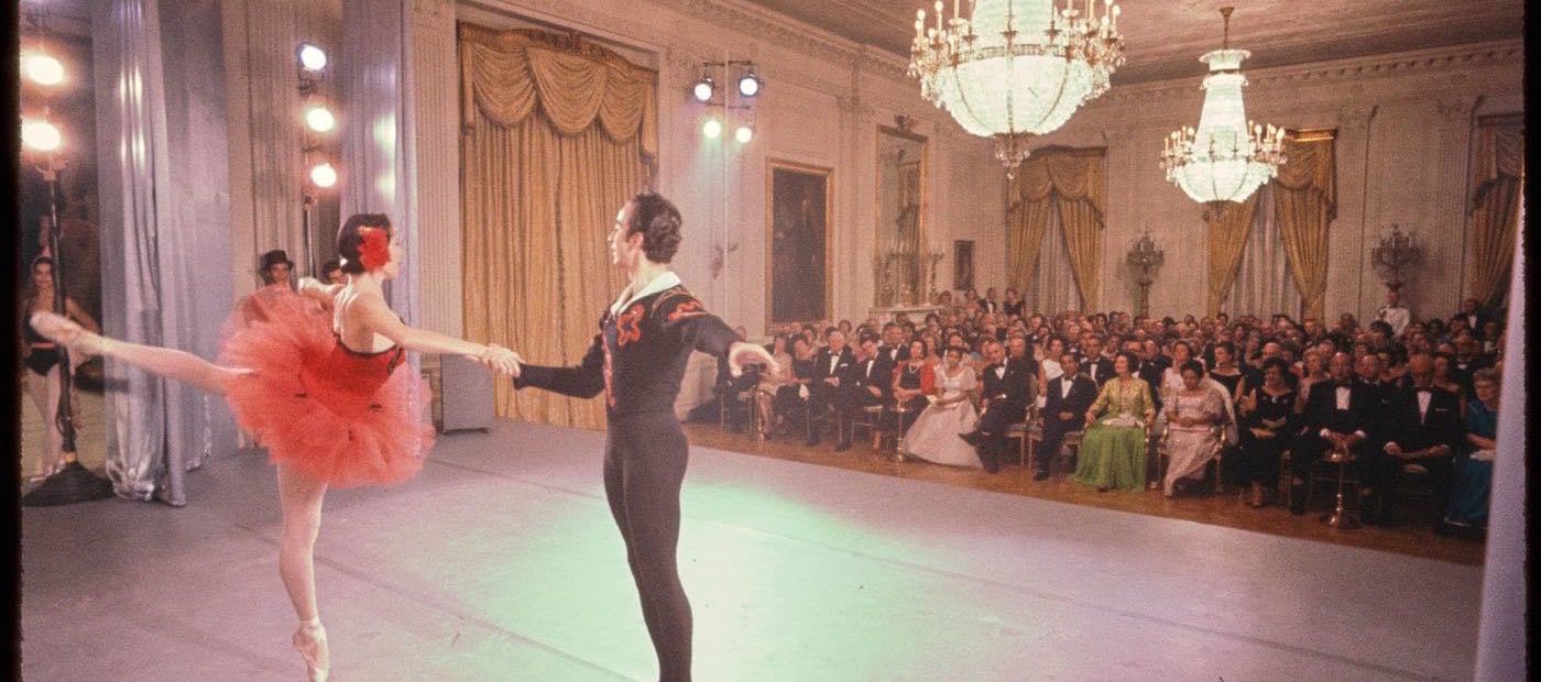 Nicholas Polajenko partnering Marjorie Tallchief in the East Room of the White House before a seated audience, 1964